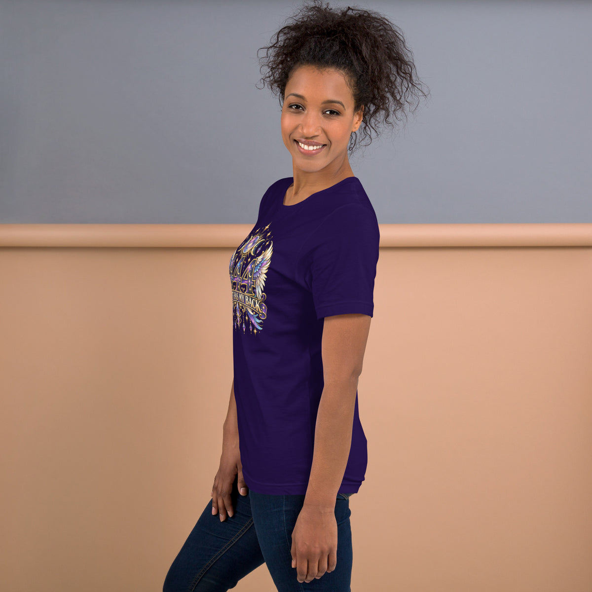 444 Spirit Has My Back angel number design, angel wings flanking the number beneath a galaxy orb and crescent moons, on a team purple unisex t-shirt, left side view
