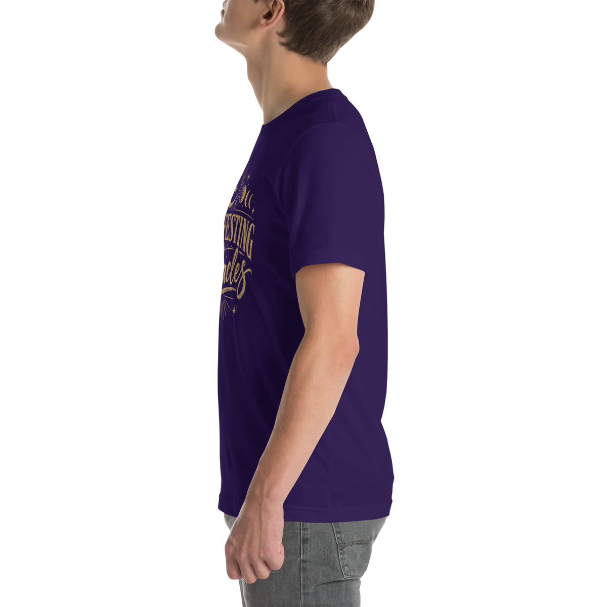 Manifesting Miracles design with moon phases in antique gold, on a team purple unisex t-shirt, left side view