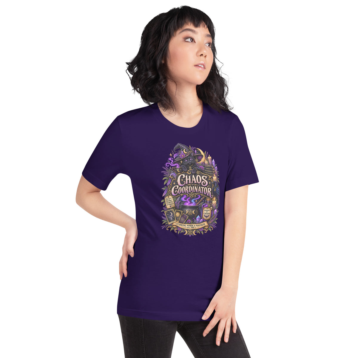 Chaos Coordinator whimsigoth design, a witchy black cat in a pointed hat, on a team purple unisex t-shirt, right front view