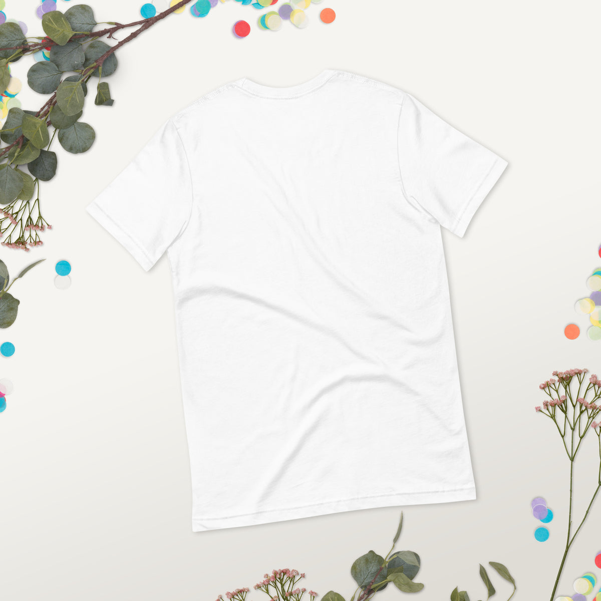 Love Gave You Wings design, on a white unisex t-shirt, plain back view with no design, styled flat lay on a gray backdrop