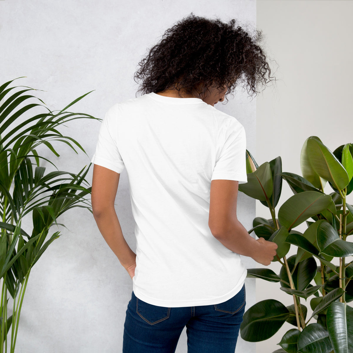 My Apothecary Has Trust Issues, a witchy black cat and a cabinet of potion bottles, on a white unisex t-shirt, back view
