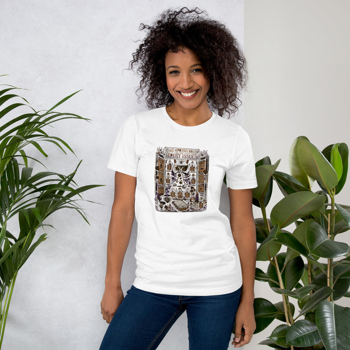 My Apothecary Has Trust Issues, a witchy black cat and a cabinet of potion bottles, on a white unisex t-shirt, front view