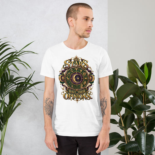 The Stars Have Their Opinions astrology design, a green and purple zodiac wheel of pictorial star signs with a crescent moon and sun face at its center, framed by clouds and gold lettering, on a white unisex t-shirt, front view