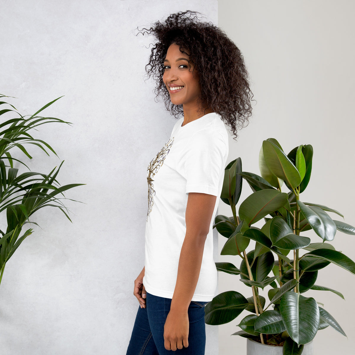 Own Your Grounded Energy design, an ornate tree with gold leaves and crystals in its roots, on a white unisex t-shirt, left side view