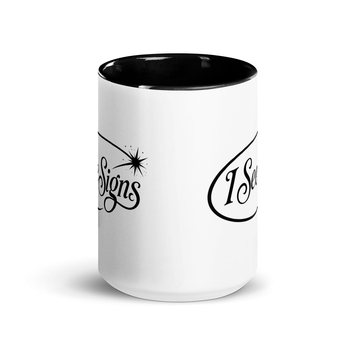 I See Signs design, the words set in black script inside a thin oval with a four-pointed star, on a white ceramic mug with a black interior, 15 oz, front view