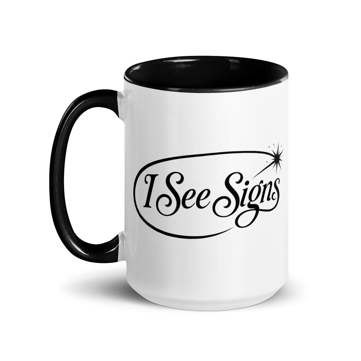 I See Signs design, the words set in black script inside a thin oval with a four-pointed star, on a white ceramic mug with a black interior, 15 oz, left side view