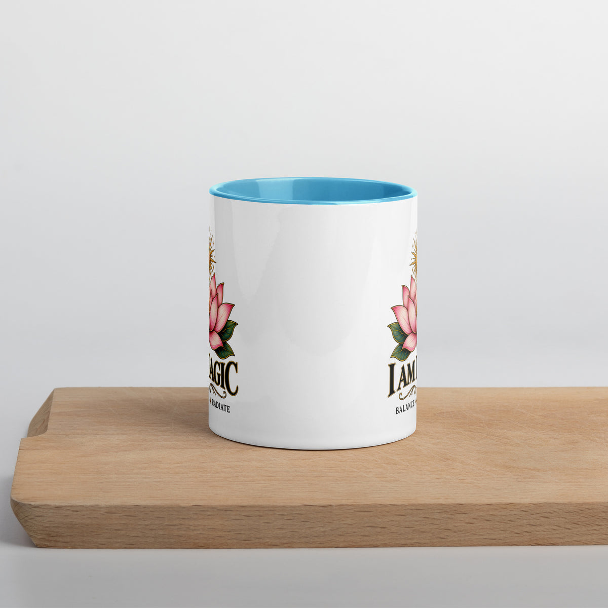 I Am Magic design with a gold lotus, Be Magical collection, on a white ceramic mug with a blue interior, 11 oz, front view