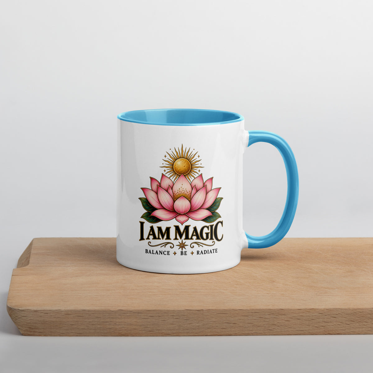 I Am Magic design with a gold lotus, Be Magical collection, on a white ceramic mug with a blue interior, 11 oz, right side view