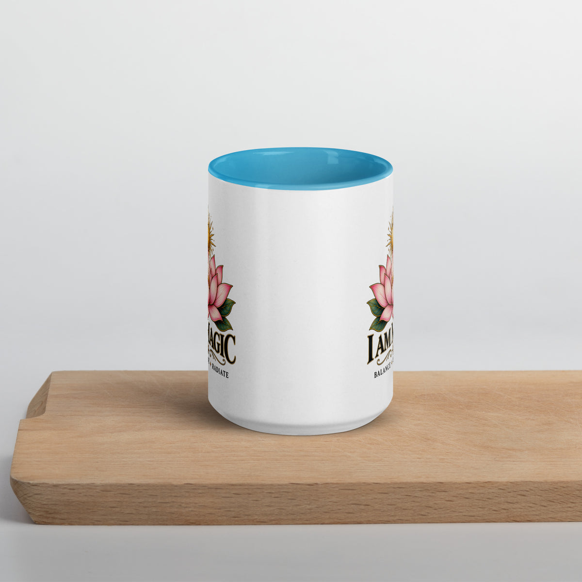 I Am Magic design with a gold lotus, Be Magical collection, on a white ceramic mug with a blue interior, 15 oz, front view