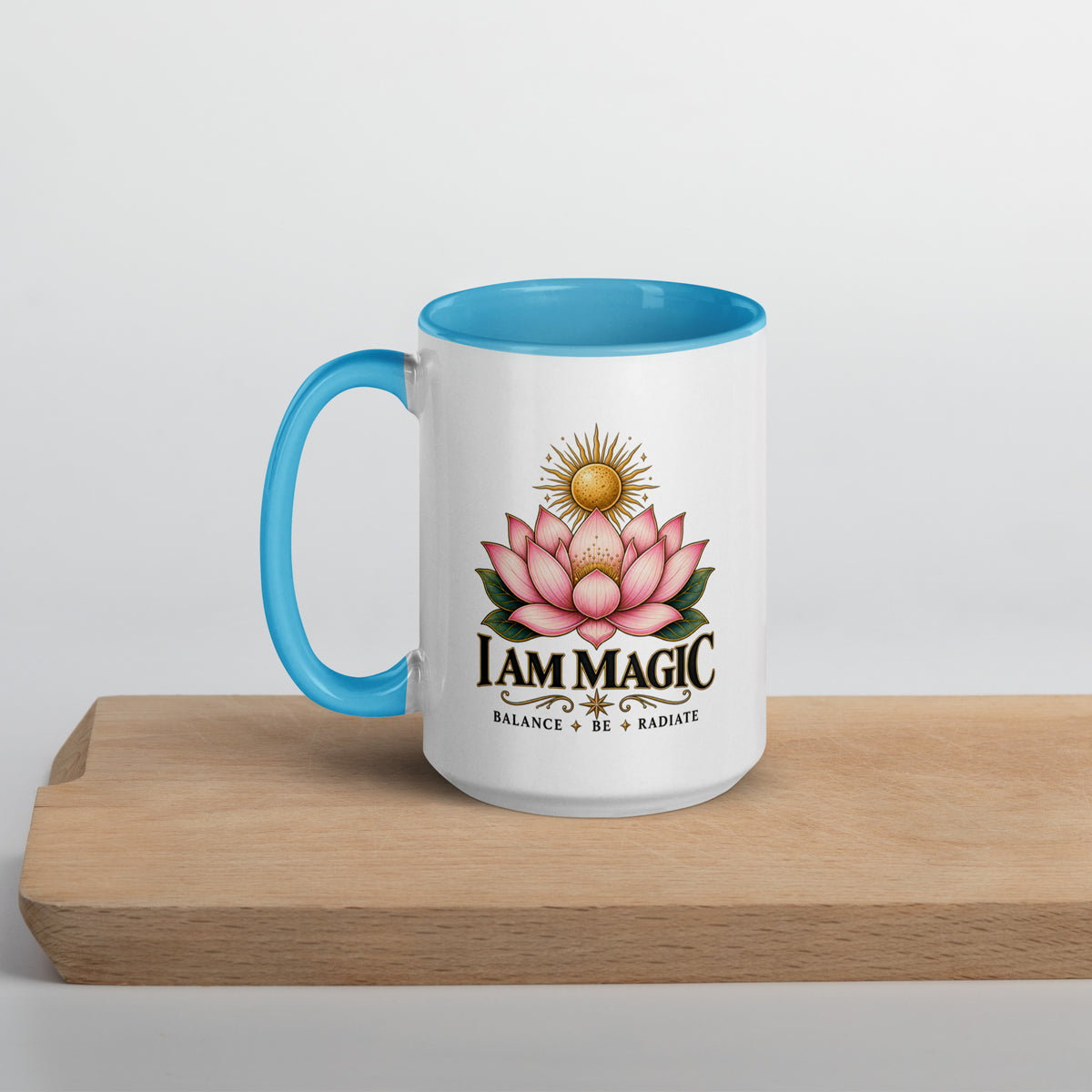 I Am Magic design with a gold lotus, Be Magical collection, on a white ceramic mug with a blue interior, 15 oz, left side view