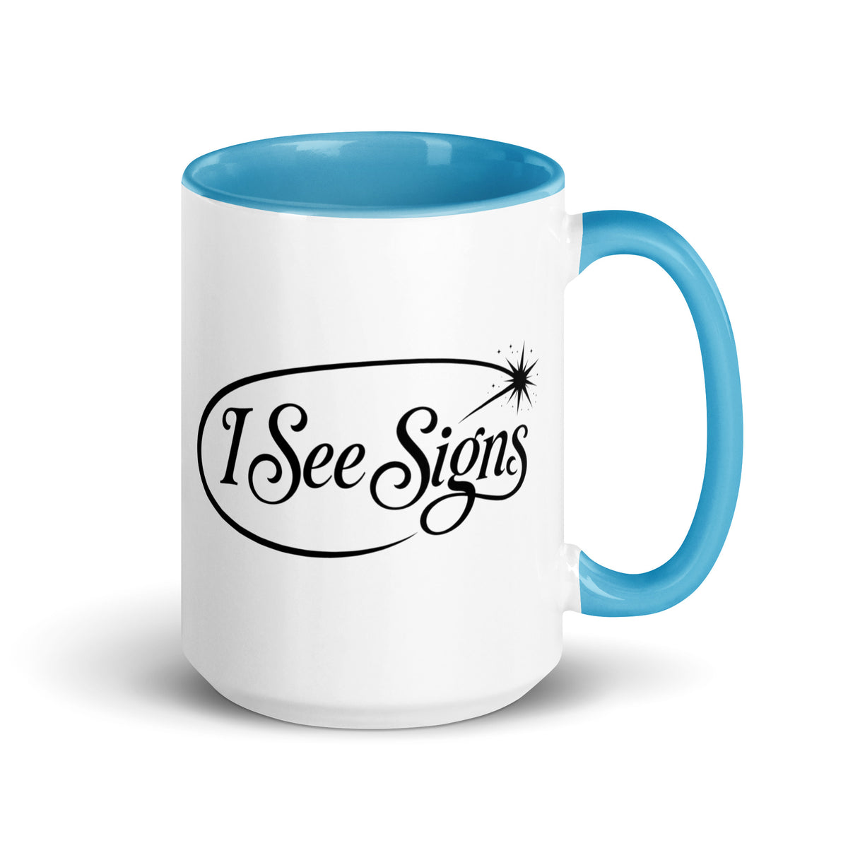I See Signs design, the words set in black script inside a thin oval with a four-pointed star, on a white ceramic mug with a blue interior, 15 oz, right side view