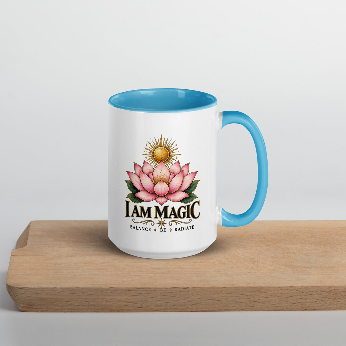 I Am Magic design with a gold lotus, Be Magical collection, on a white ceramic mug with a blue interior, 15 oz, right side view