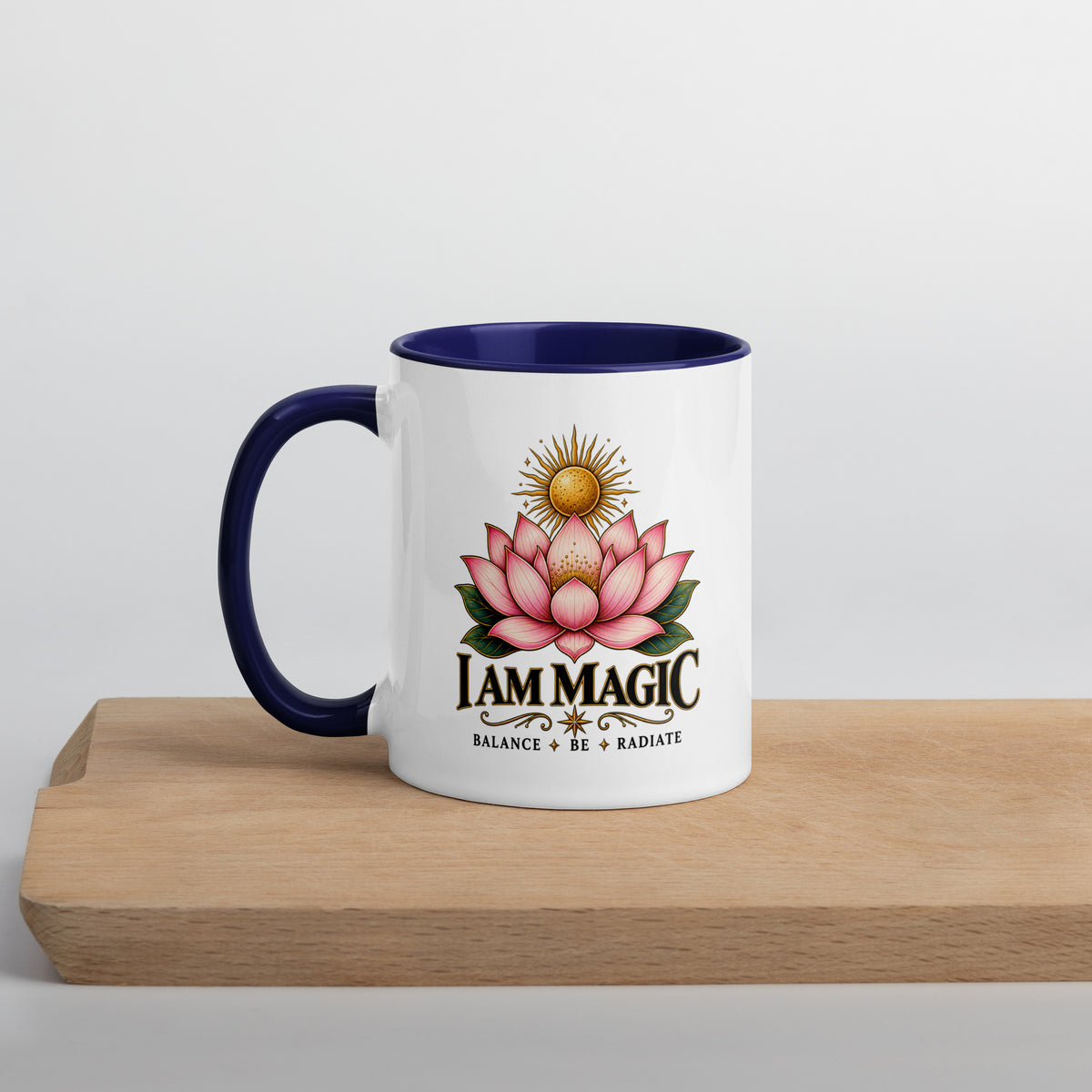I Am Magic design with a gold lotus, Be Magical collection, on a white ceramic mug with a dark blue interior, 11 oz, left side view