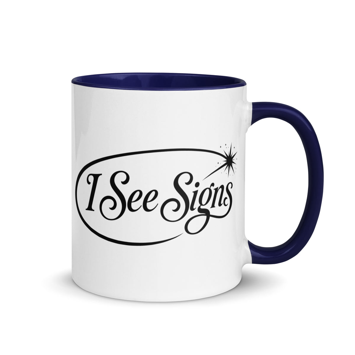 I See Signs design, the words set in black script inside a thin oval with a four-pointed star, on a white ceramic mug with a dark blue interior, 11 oz, right side view