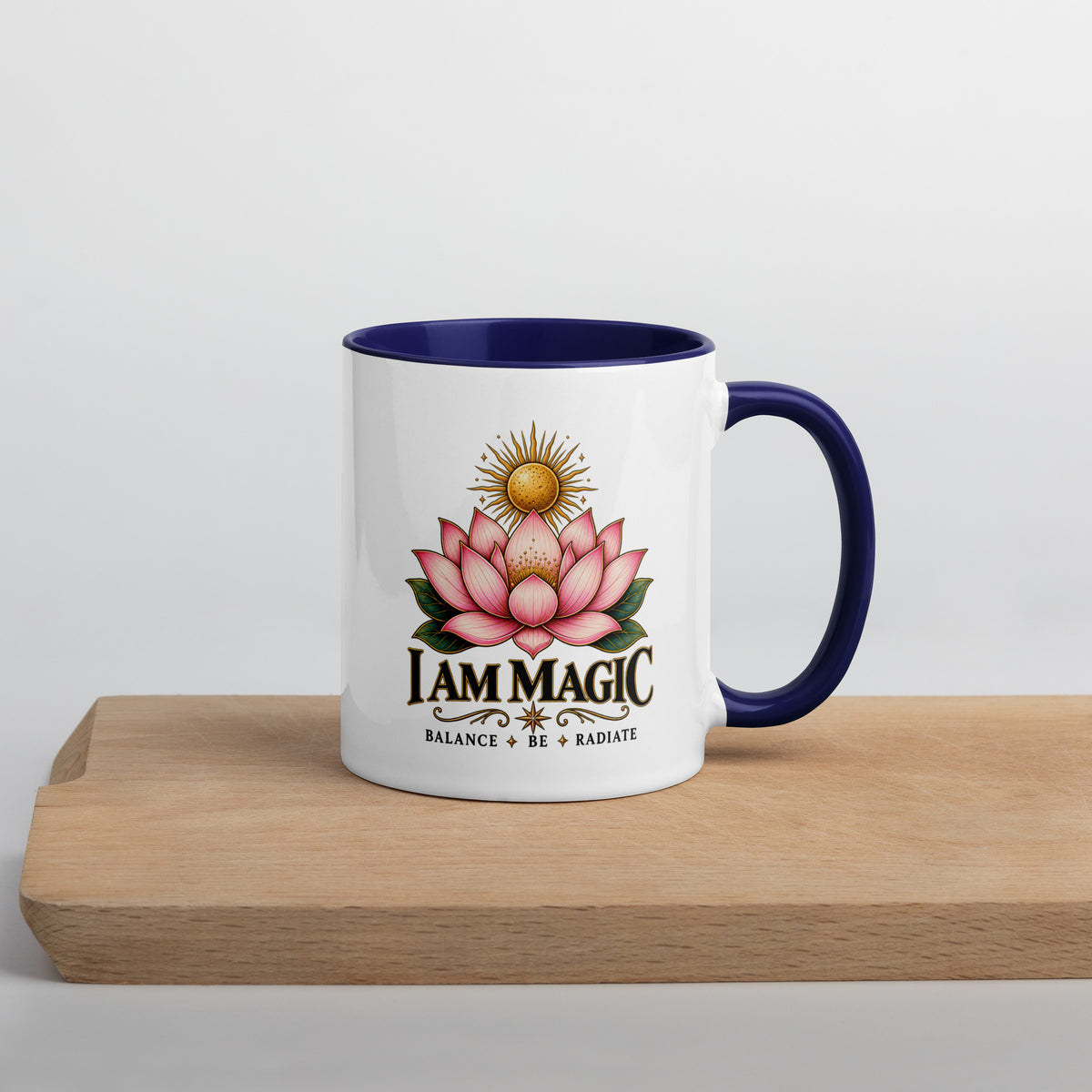 I Am Magic design with a gold lotus, Be Magical collection, on a white ceramic mug with a dark blue interior, 11 oz, right side view