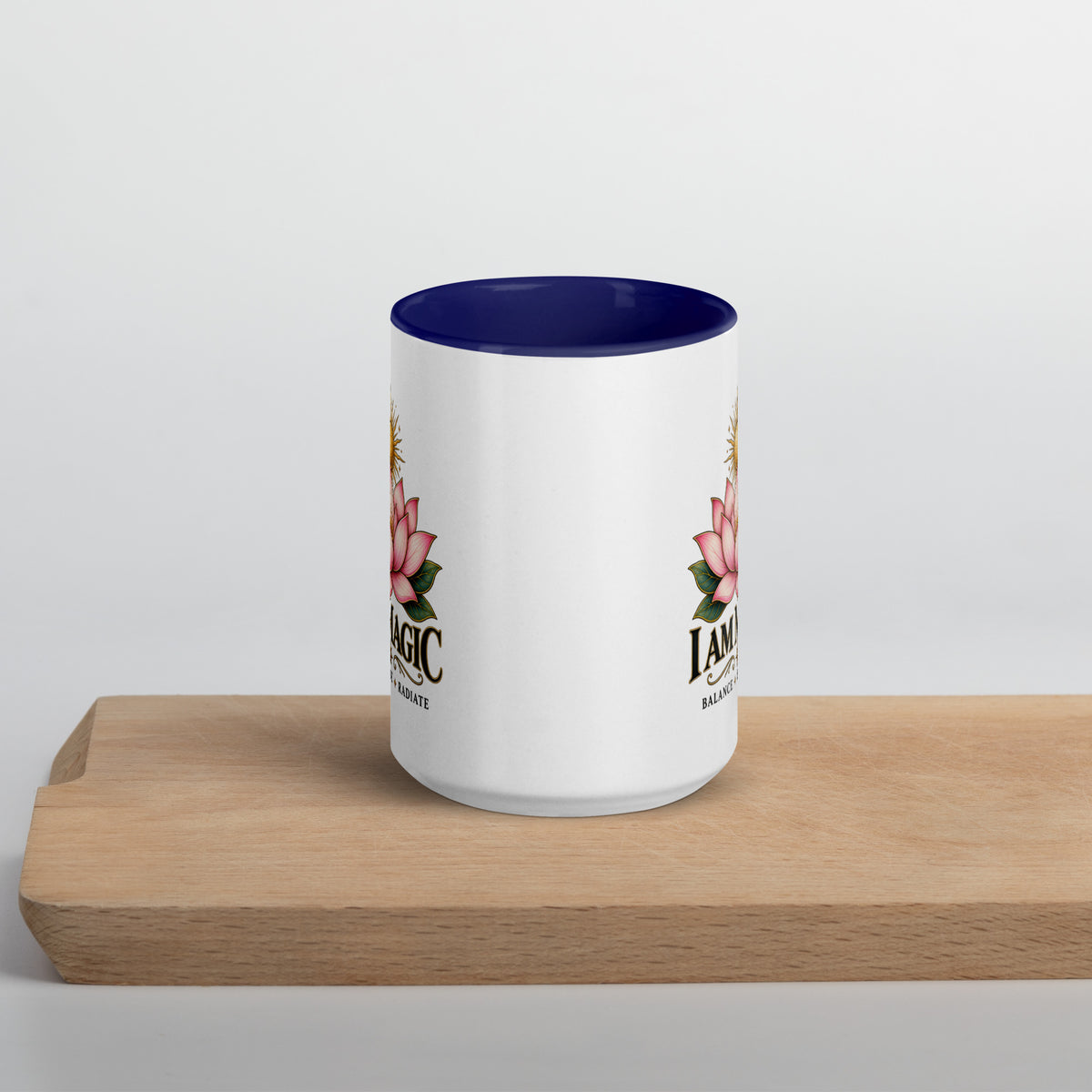 I Am Magic design with a gold lotus, Be Magical collection, on a white ceramic mug with a dark blue interior, 15 oz, front view