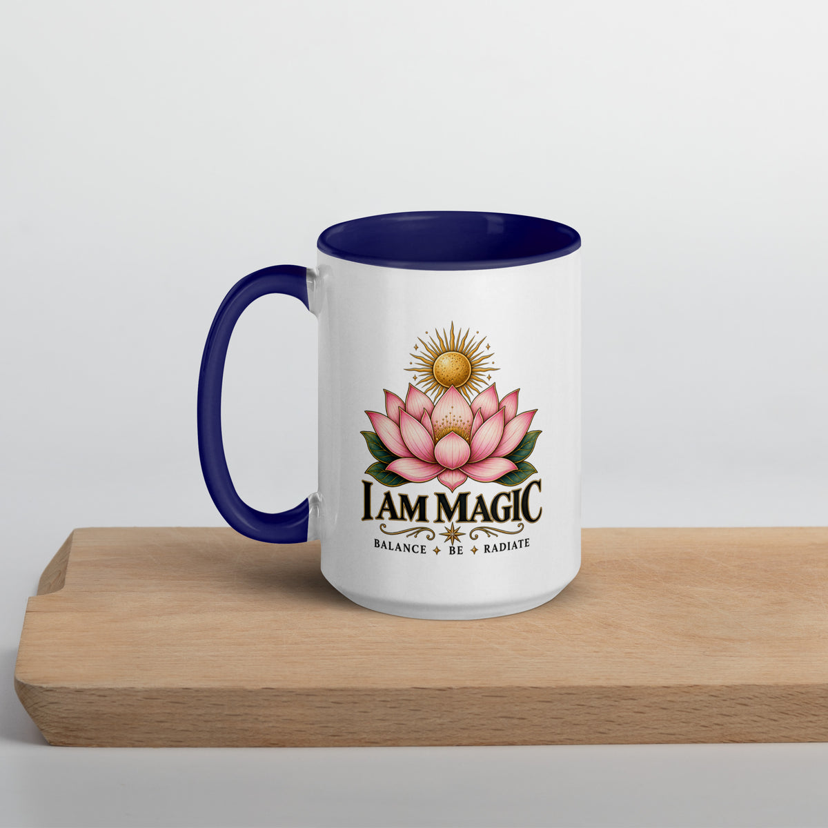 I Am Magic design with a gold lotus, Be Magical collection, on a white ceramic mug with a dark blue interior, 15 oz, left side view