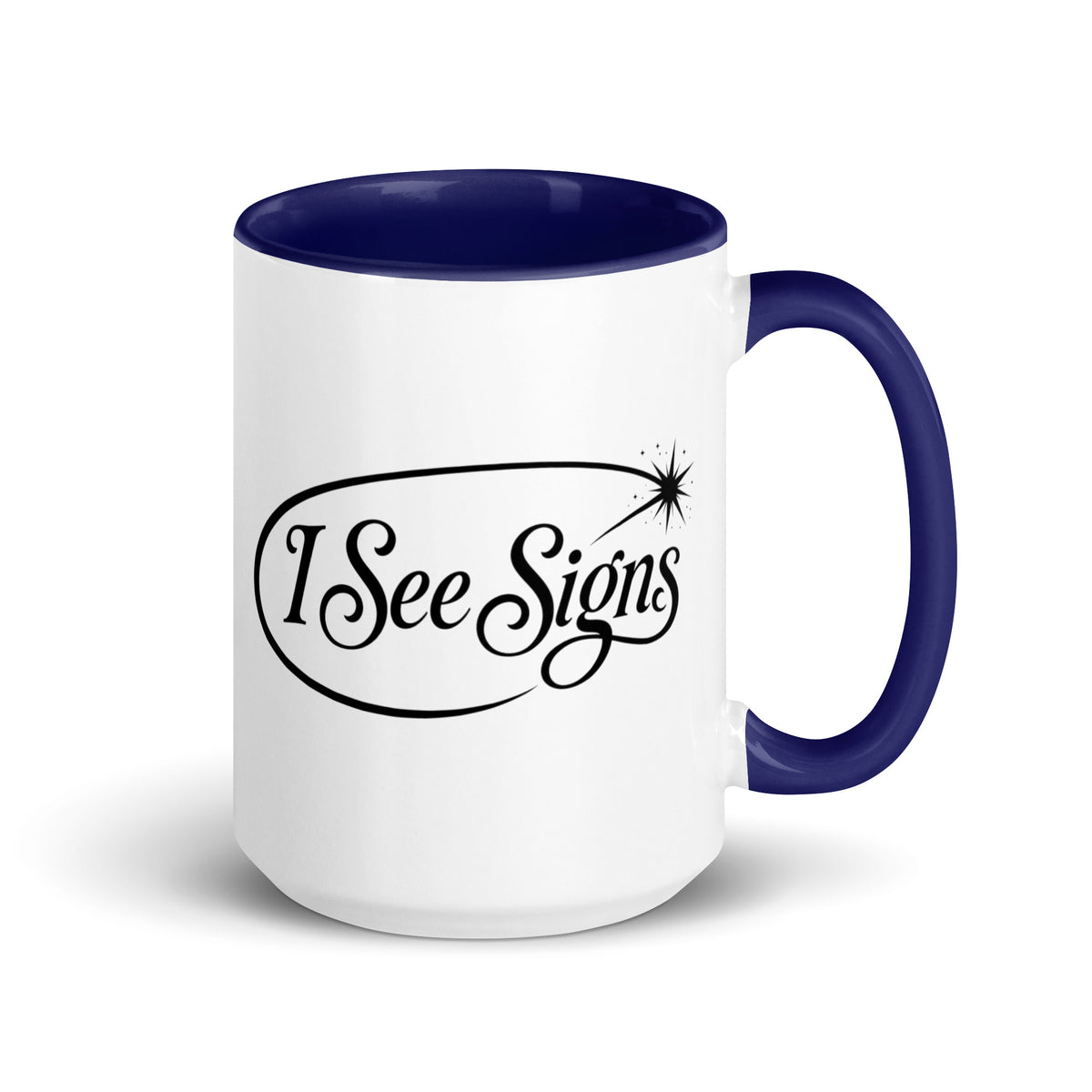 I See Signs design, the words set in black script inside a thin oval with a four-pointed star, on a white ceramic mug with a dark blue interior, 15 oz, right side view