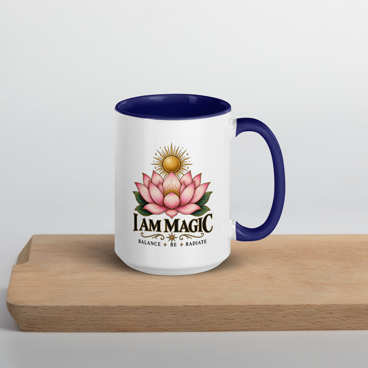 I Am Magic design with a gold lotus, Be Magical collection, on a white ceramic mug with a dark blue interior, 15 oz, right side view