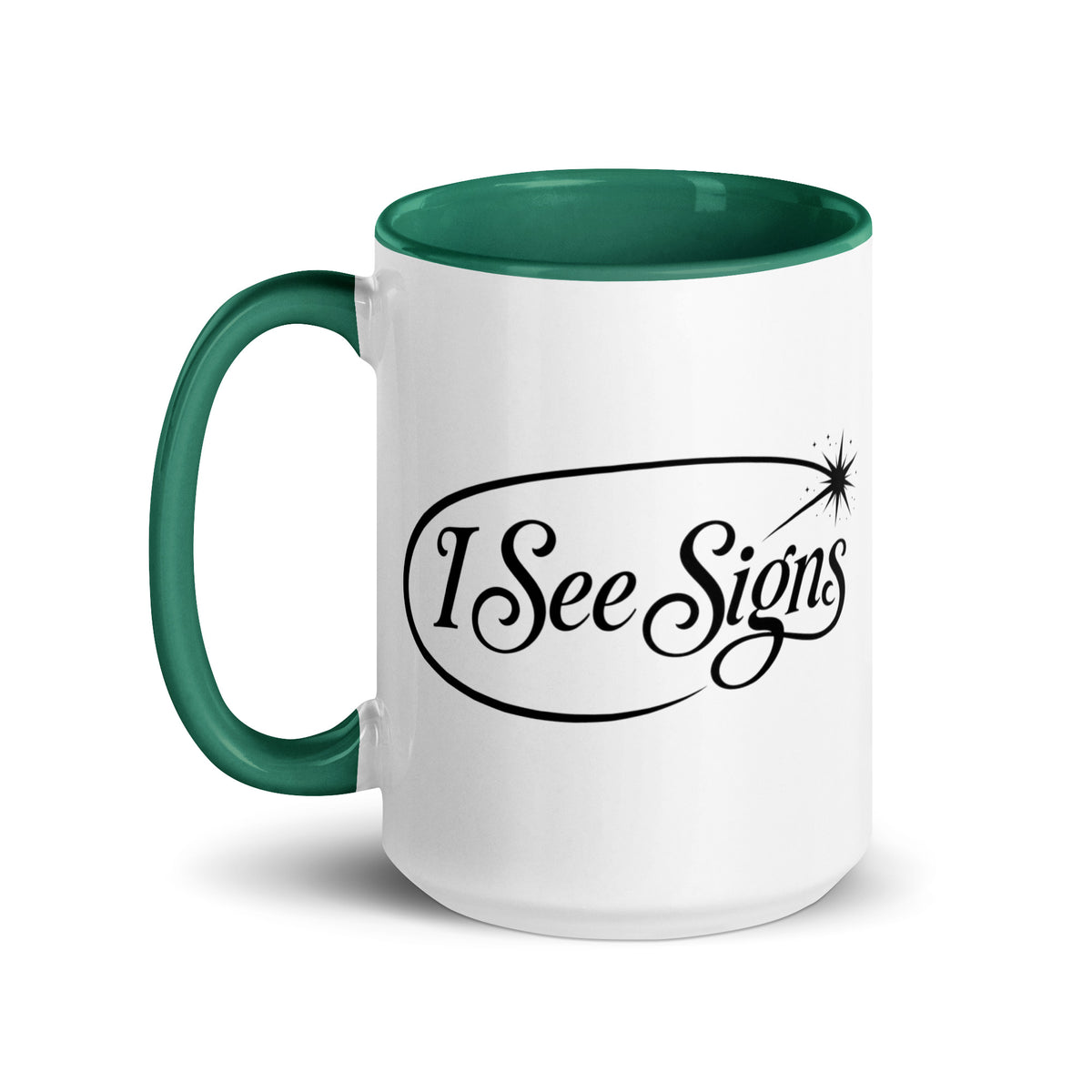 I See Signs design, the words set in black script inside a thin oval with a four-pointed star, on a white ceramic mug with a dark green interior, 15 oz, left side view