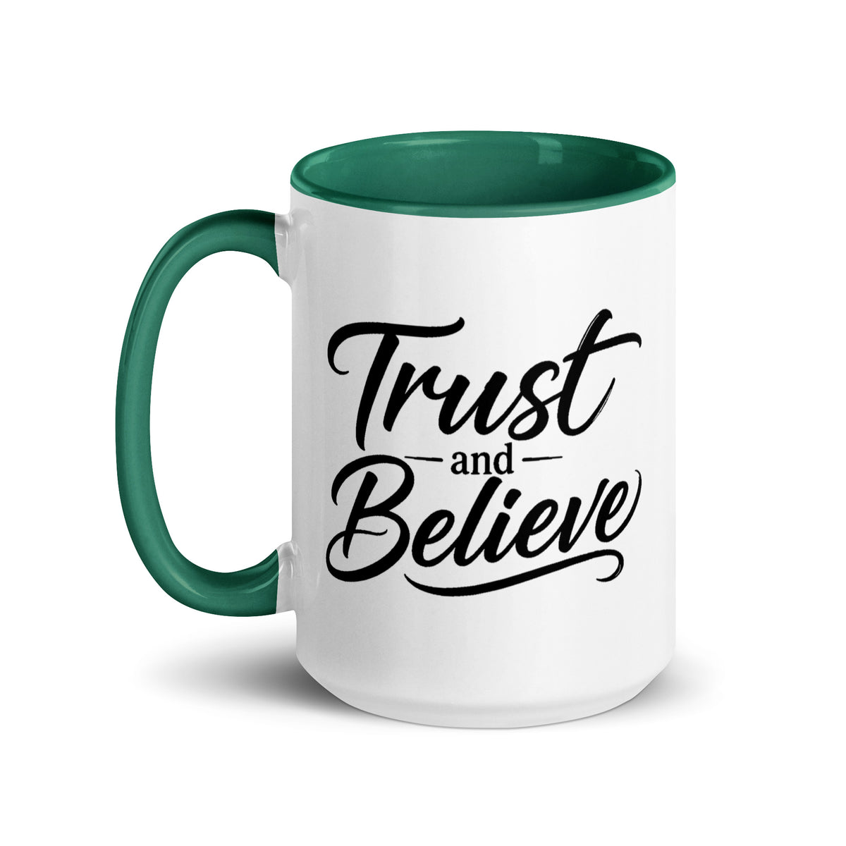 Trust and Believe design, on a white ceramic mug with a dark green interior, 15 oz, left side view