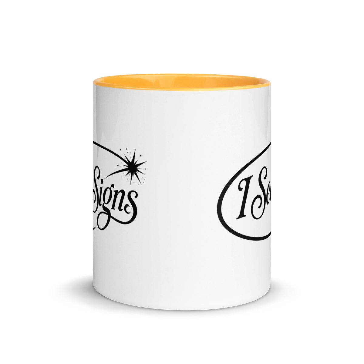I See Signs design, the words set in black script inside a thin oval with a four-pointed star, on a white ceramic mug with a golden yellow interior, 11 oz, front view