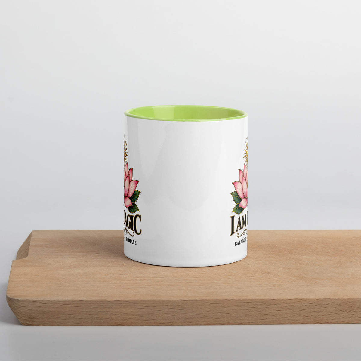 I Am Magic design with a gold lotus, Be Magical collection, on a white ceramic mug with a green interior, 11 oz, front view