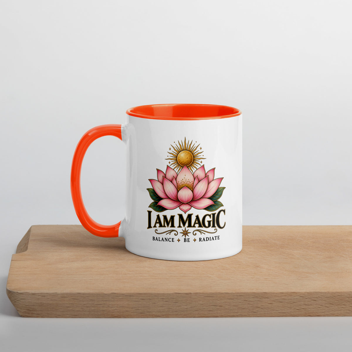 I Am Magic design with a gold lotus, Be Magical collection, on a white ceramic mug with an orange interior, 11 oz, left side view