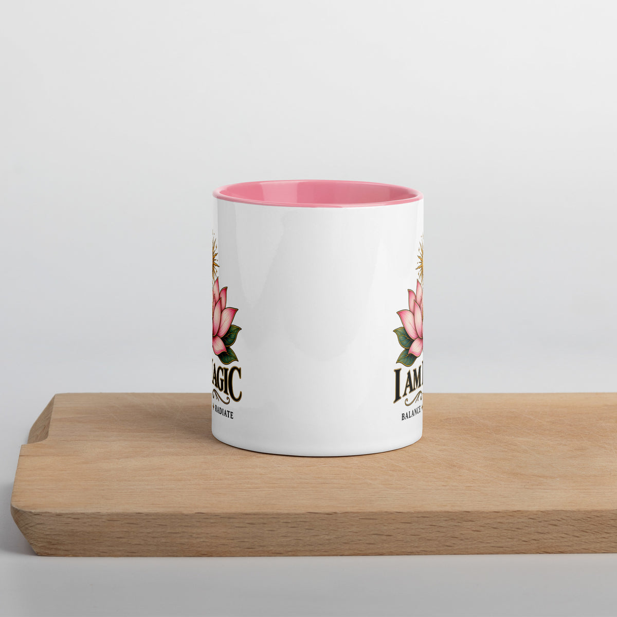 I Am Magic design with a gold lotus, Be Magical collection, on a white ceramic mug with a pink interior, 11 oz, front view