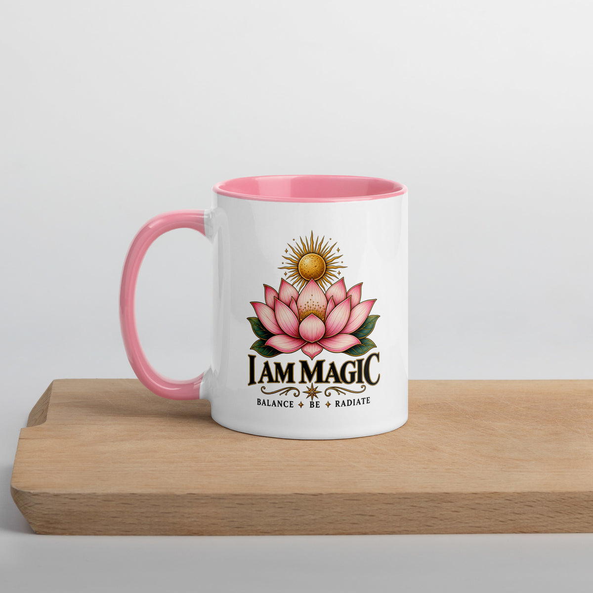 I Am Magic design with a gold lotus, Be Magical collection, on a white ceramic mug with a pink interior, 11 oz, left side view
