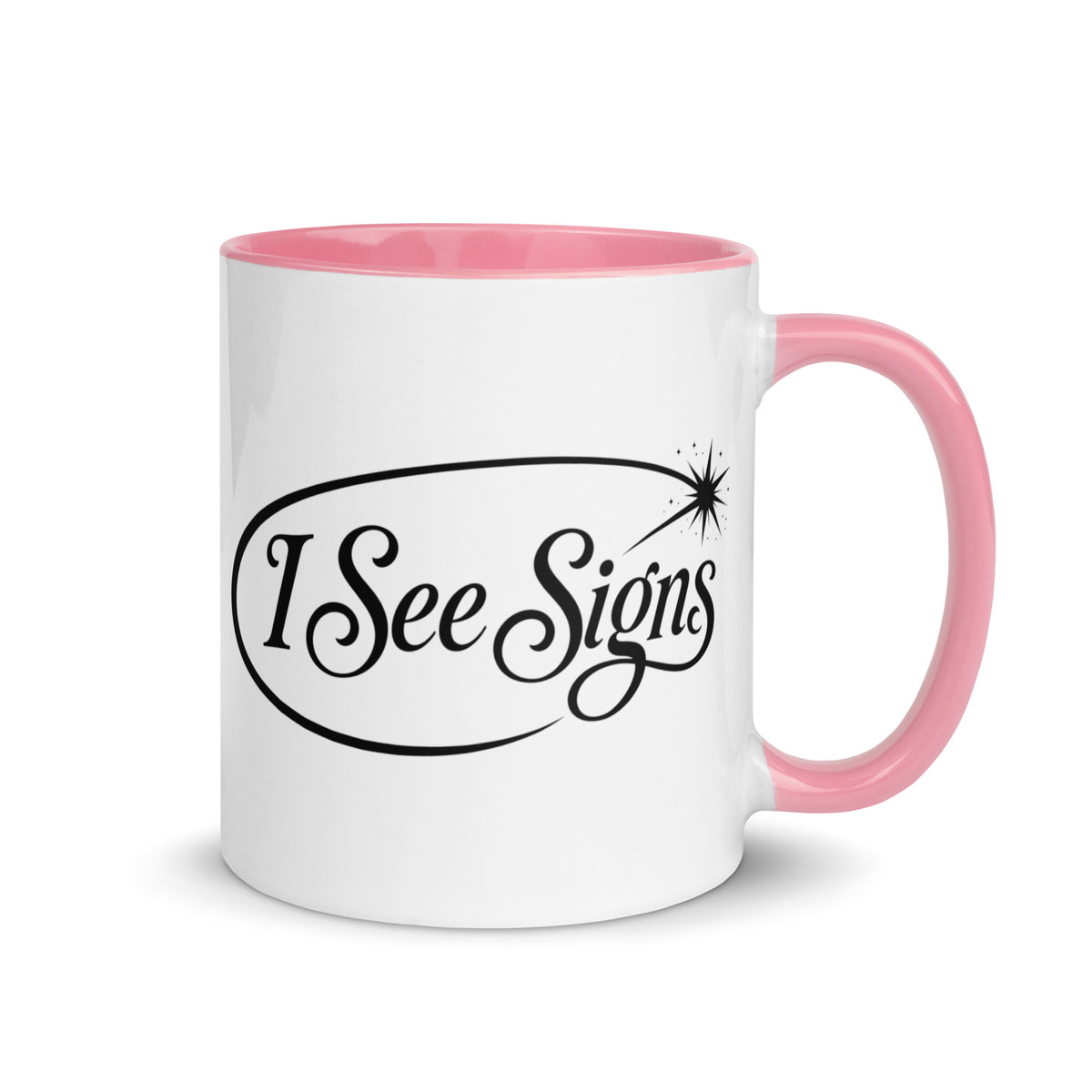 I See Signs design, the words set in black script inside a thin oval with a four-pointed star, on a white ceramic mug with a pink interior, 11 oz, right side view