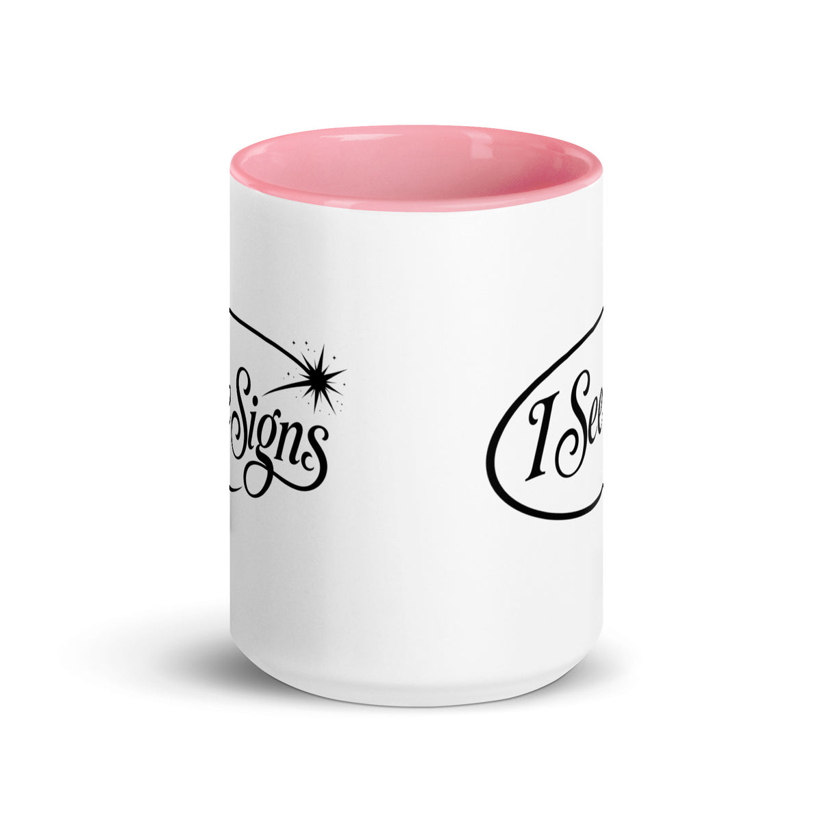 I See Signs design, the words set in black script inside a thin oval with a four-pointed star, on a white ceramic mug with a pink interior, 15 oz, front view