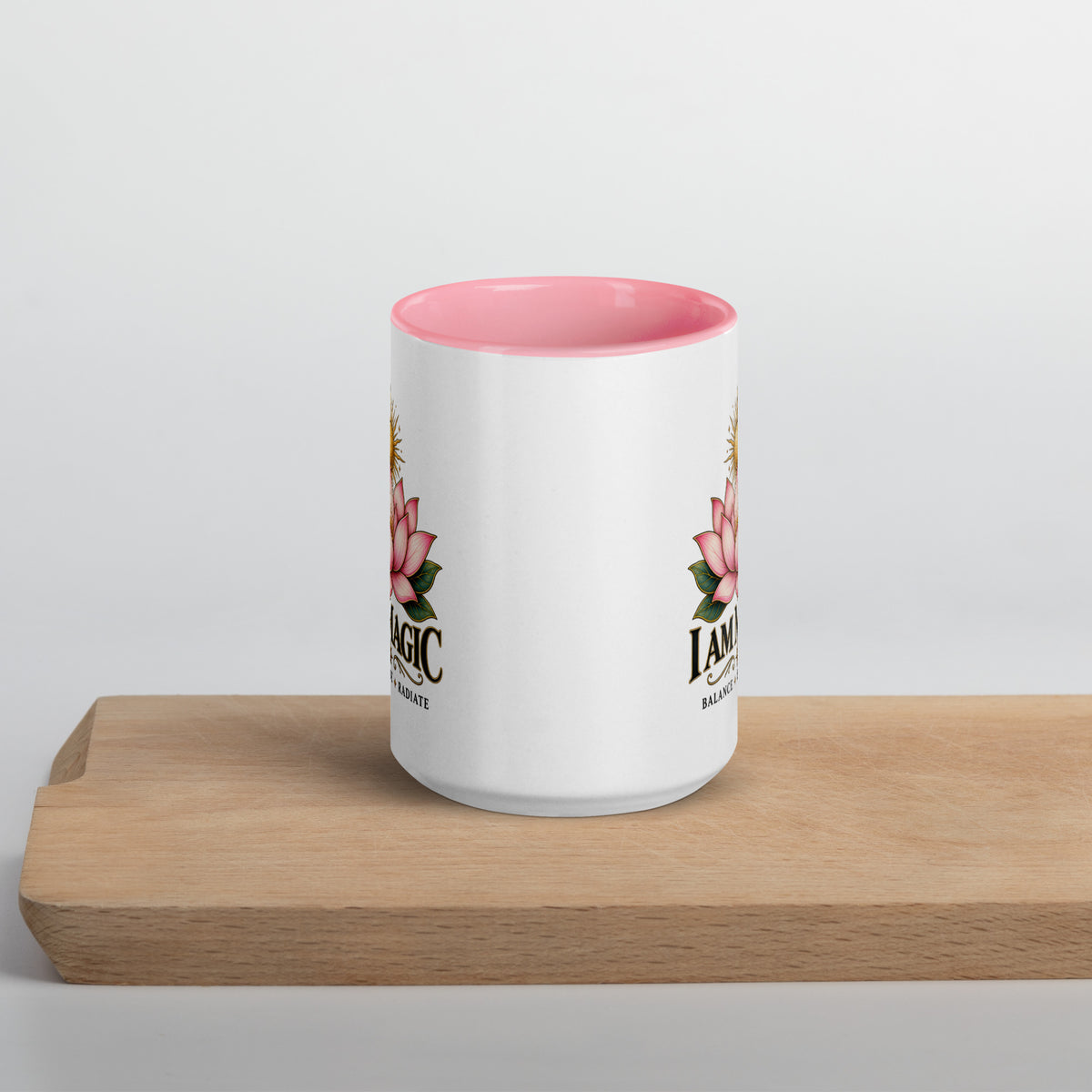 I Am Magic design with a gold lotus, Be Magical collection, on a white ceramic mug with a pink interior, 15 oz, front view