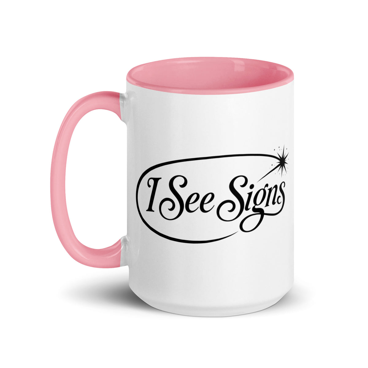I See Signs design, the words set in black script inside a thin oval with a four-pointed star, on a white ceramic mug with a pink interior, 15 oz, left side view