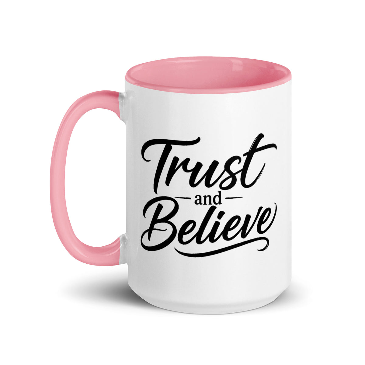 Trust and Believe design, on a white ceramic mug with a pink interior, 15 oz, left side view