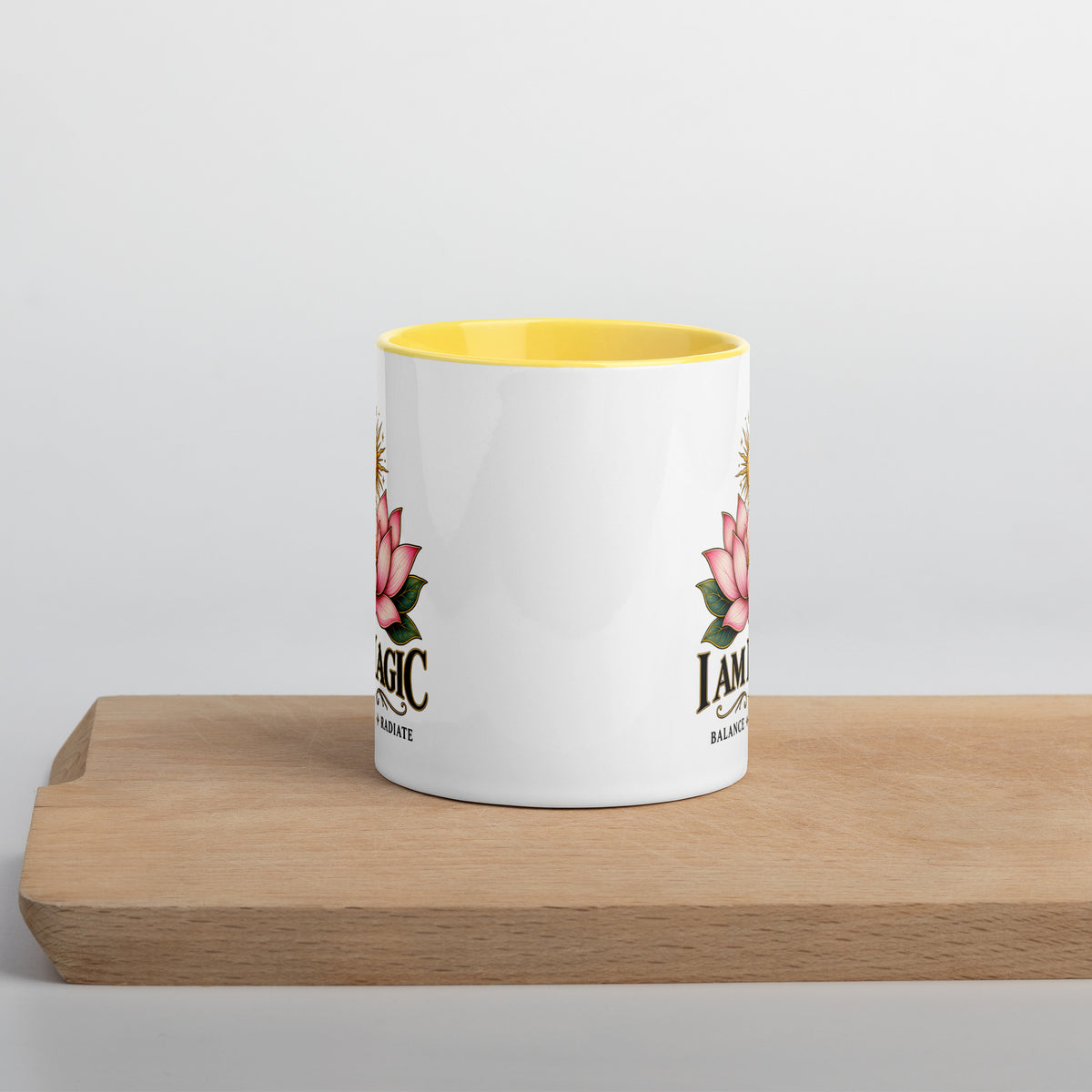 I Am Magic design with a gold lotus, Be Magical collection, on a white ceramic mug with a yellow interior, 11 oz, front view