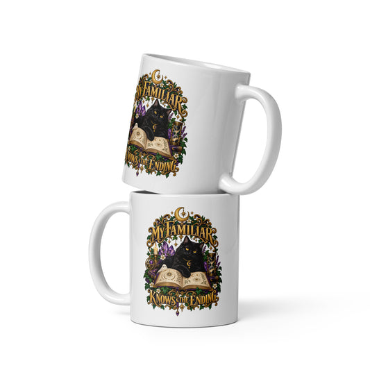 Black cat familiar on a grimoire, witchy celestial design on a white glossy 11 oz mug