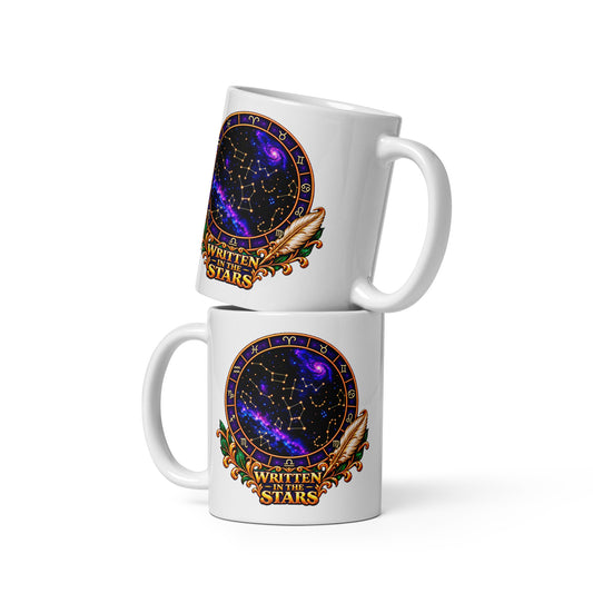 Written In The Stars astrology design, a zodiac wheel of constellations and a galaxy framed by gold scrollwork and a feather quill, on a 11 oz white glossy mug, front view