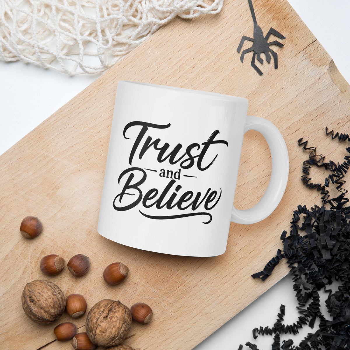 Trust and Believe design, on a white glossy mug, 11 oz, in a Halloween scene