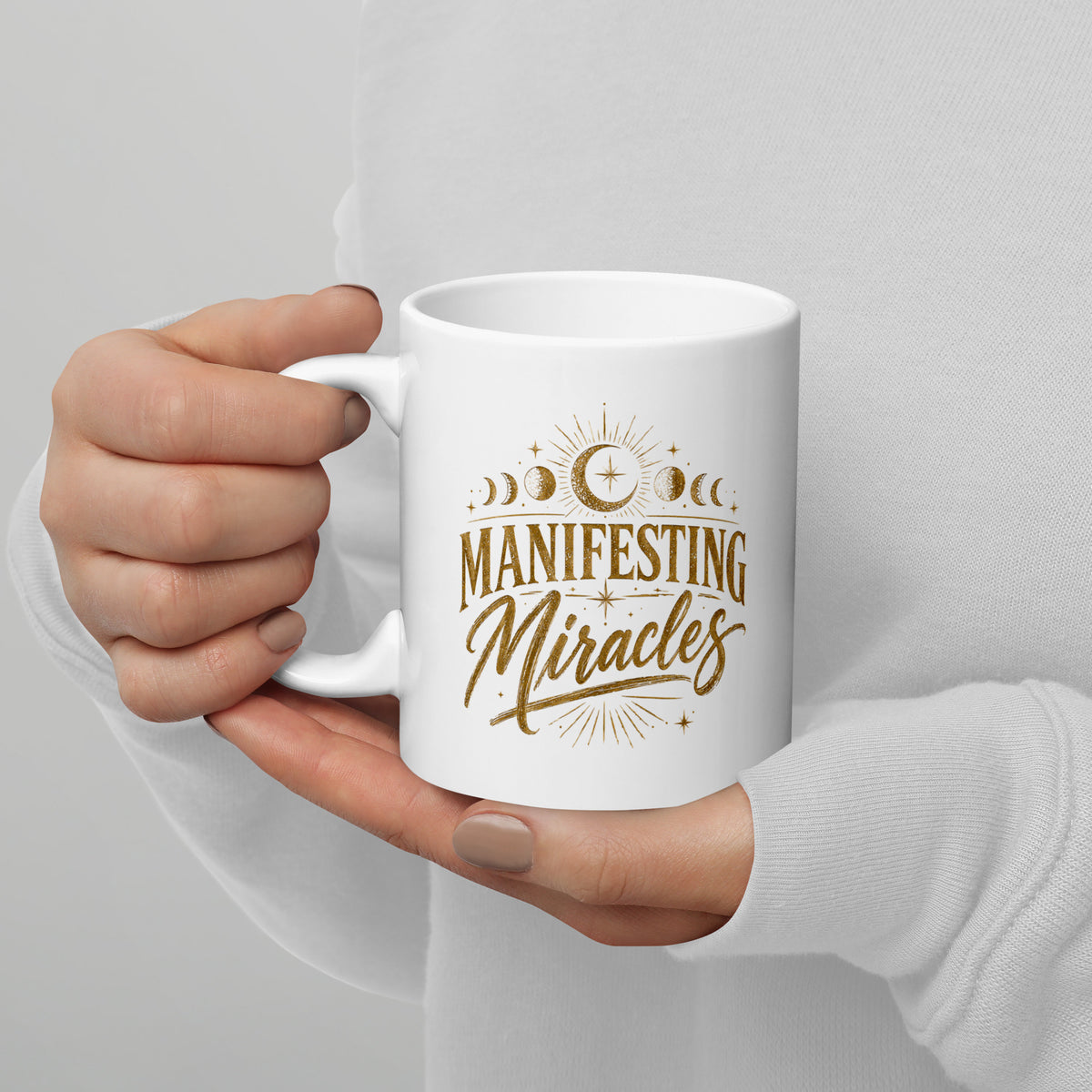 Manifesting Miracles design with moon phases in antique gold, on a white glossy mug, 11 oz, handle on the left
