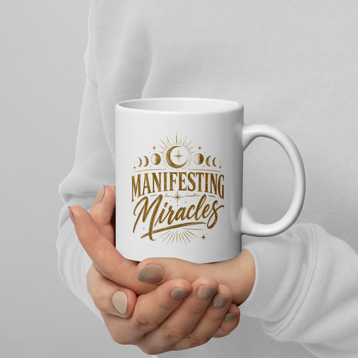 Manifesting Miracles design with moon phases in antique gold, on a white glossy mug, 11 oz, handle on the right