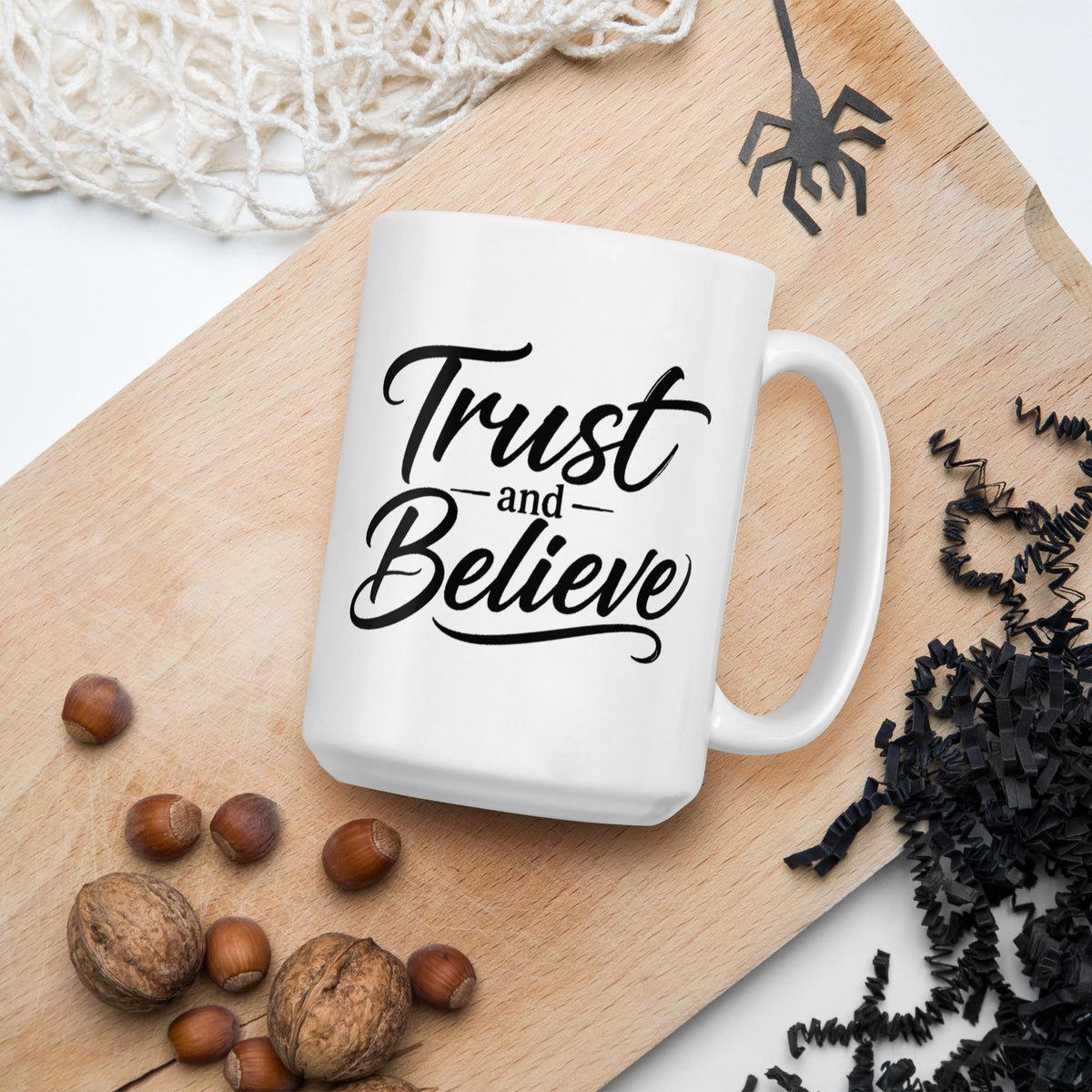 Trust and Believe design, on a white glossy mug, 15 oz, in a Halloween scene