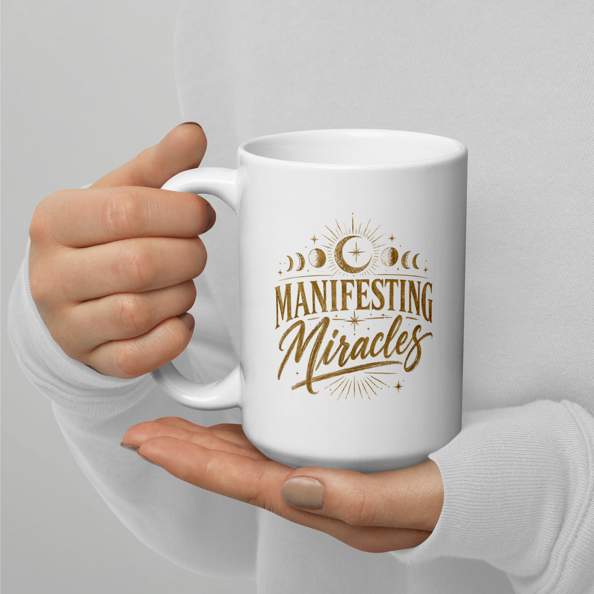 Manifesting Miracles design with moon phases in antique gold, on a white glossy mug, 15 oz, handle on the left