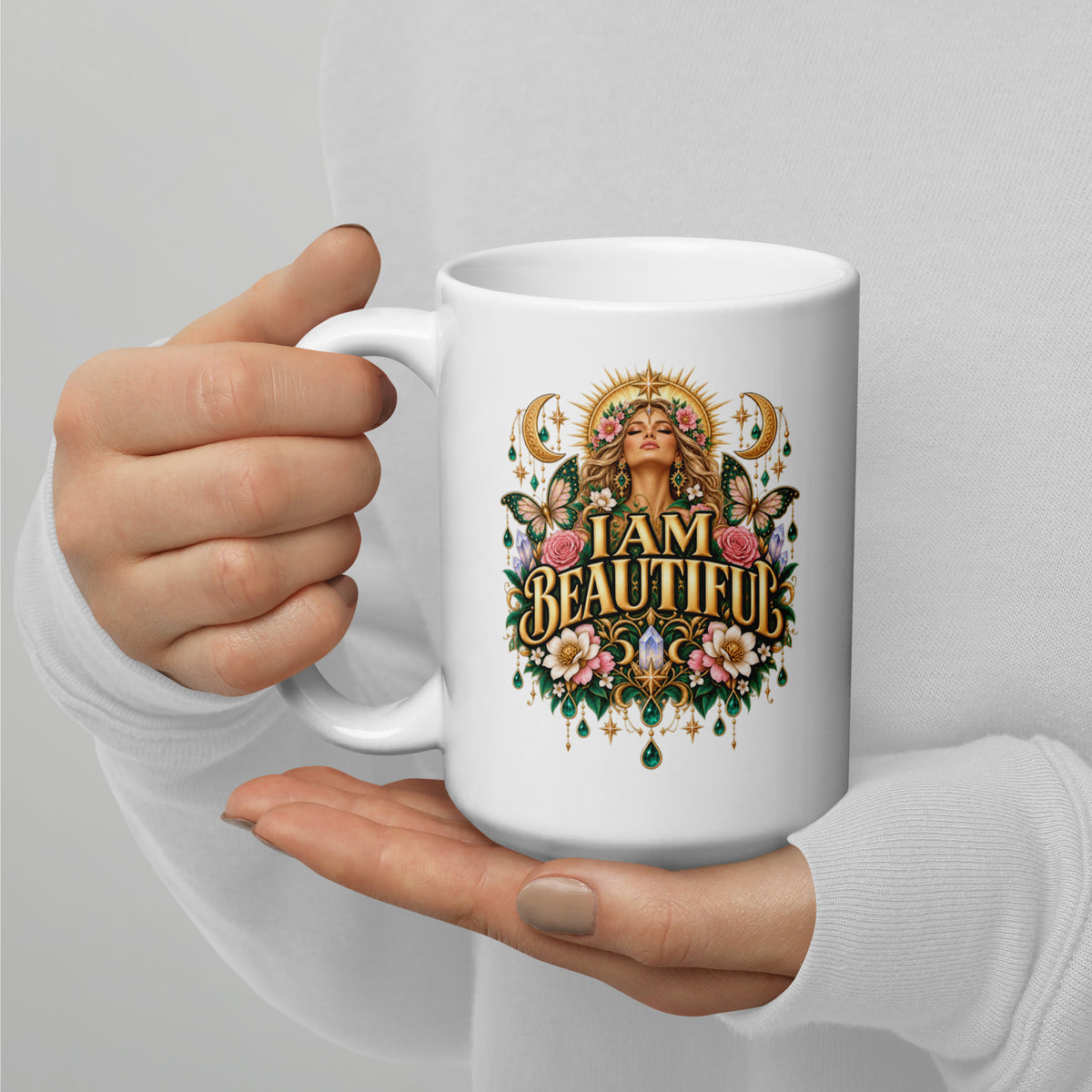 I Am Beautiful affirmation design with roses, butterflies and twin crescents in gold, on a white glossy mug, 15 oz, handle on the left