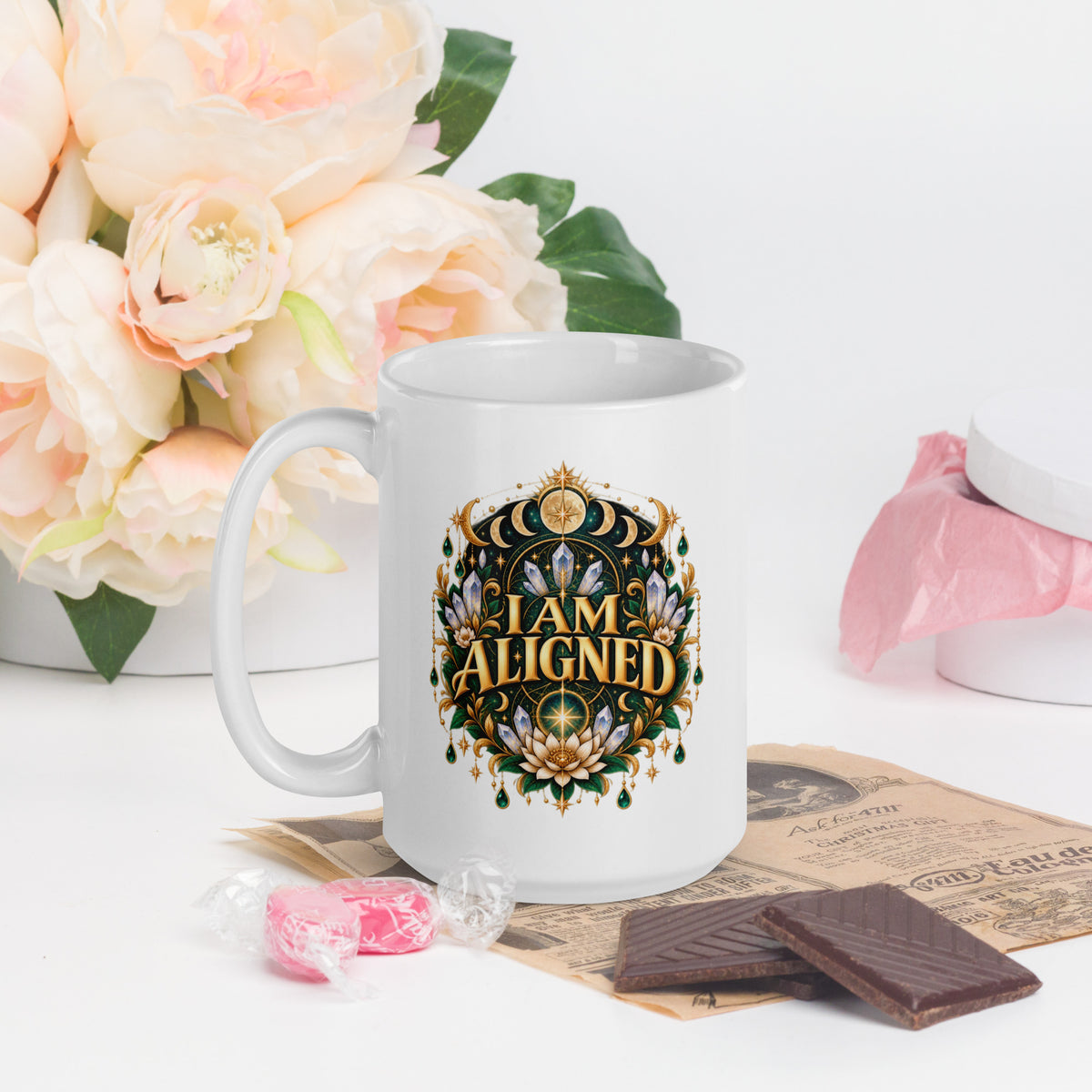 I Am Aligned affirmation design with a lotus, quartz and moon phases in gold, on a white glossy mug, 15 oz, handle on the left
