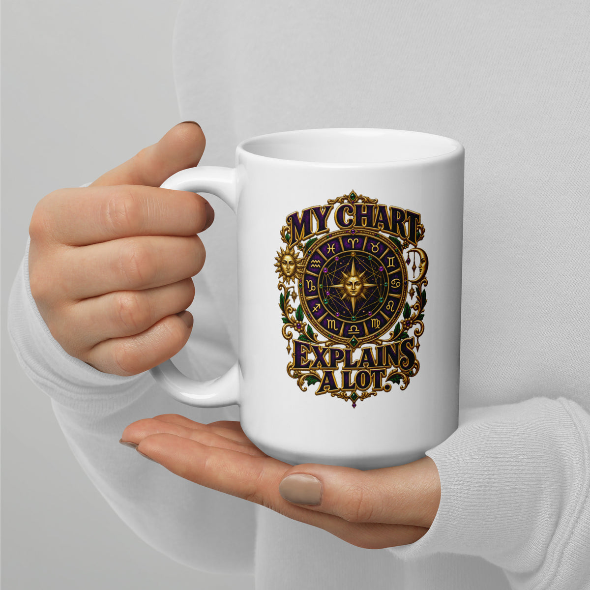 My Chart Explains A Lot astrology design, a purple and gold zodiac wheel with a gold sun face at its center, flanked by a sun and a crescent moon, on a 15 oz white glossy mug, handle on the left