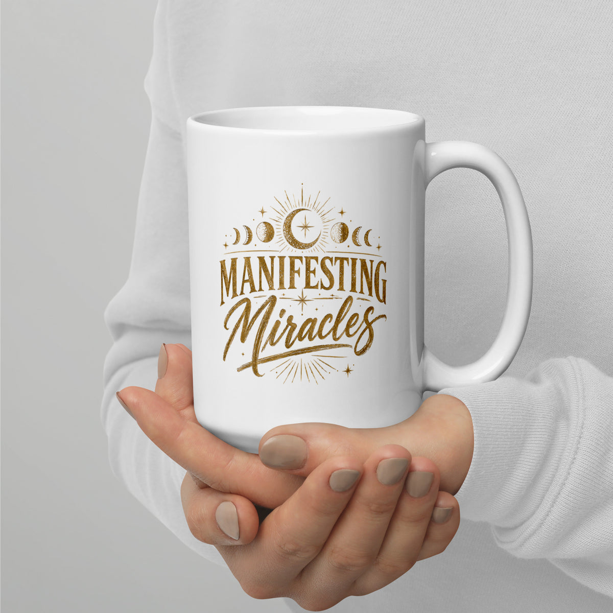 Manifesting Miracles design with moon phases in antique gold, on a white glossy mug, 15 oz, handle on the right