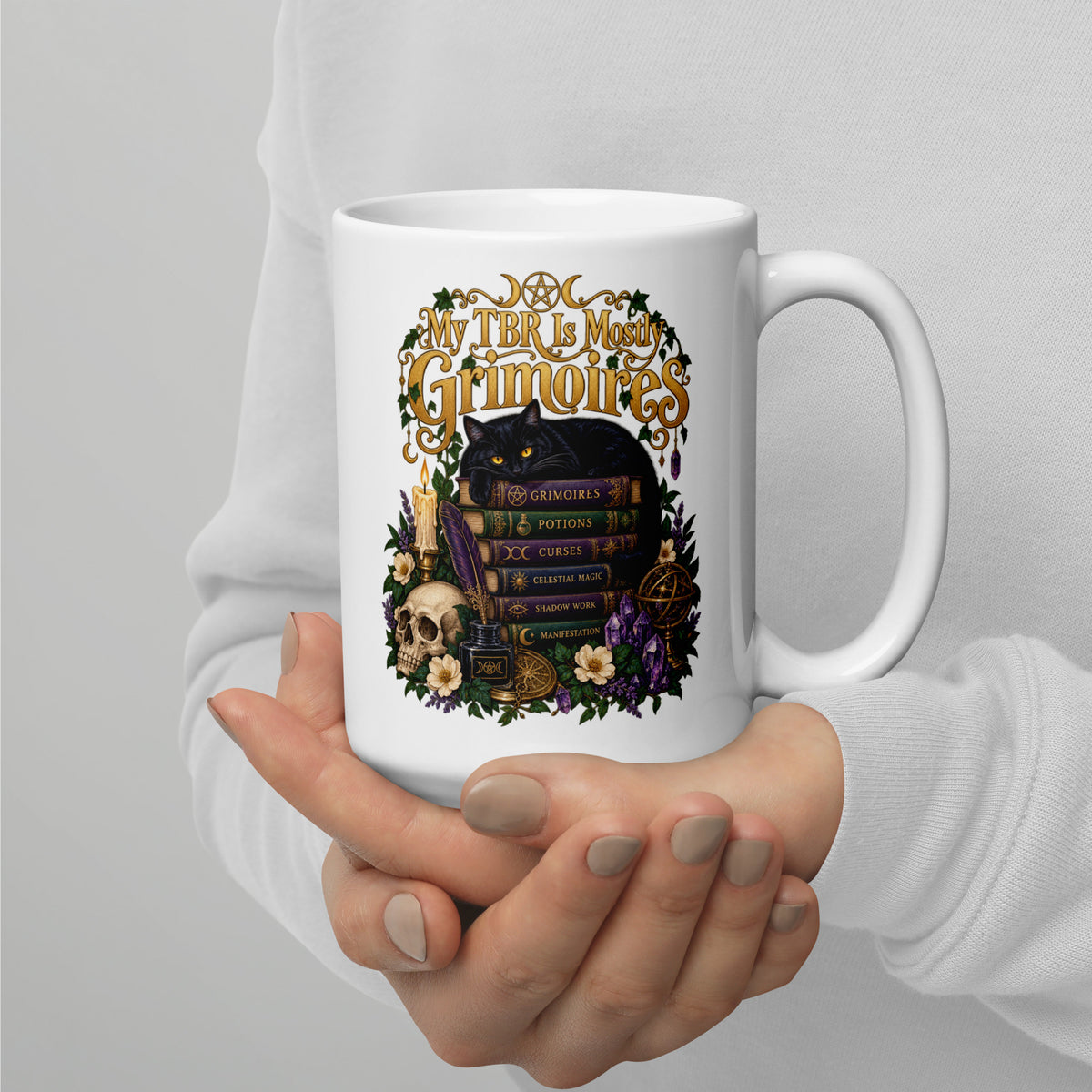 My TBR Is Mostly Grimoires dark academia design, a black cat guarding a stack of grimoires beside a skull, on a white glossy mug, 15 oz, handle on the right