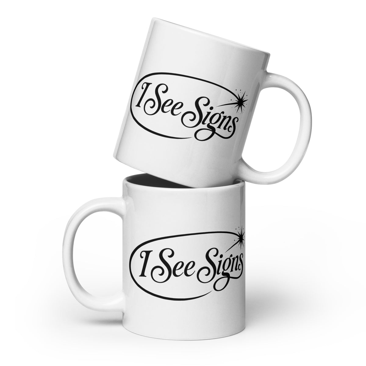 I See Signs design, the words set in black script inside a thin oval with a four-pointed star, on a white glossy mug, 20 oz, front view