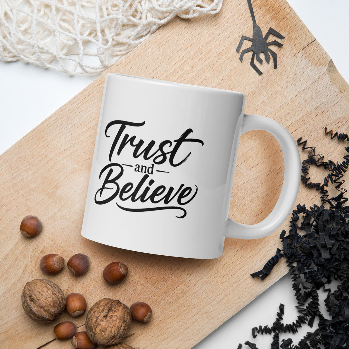 Trust and Believe design, on a white glossy mug, 20 oz, in a Halloween scene